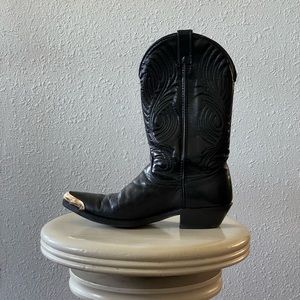 Black leather boots with gold tips.